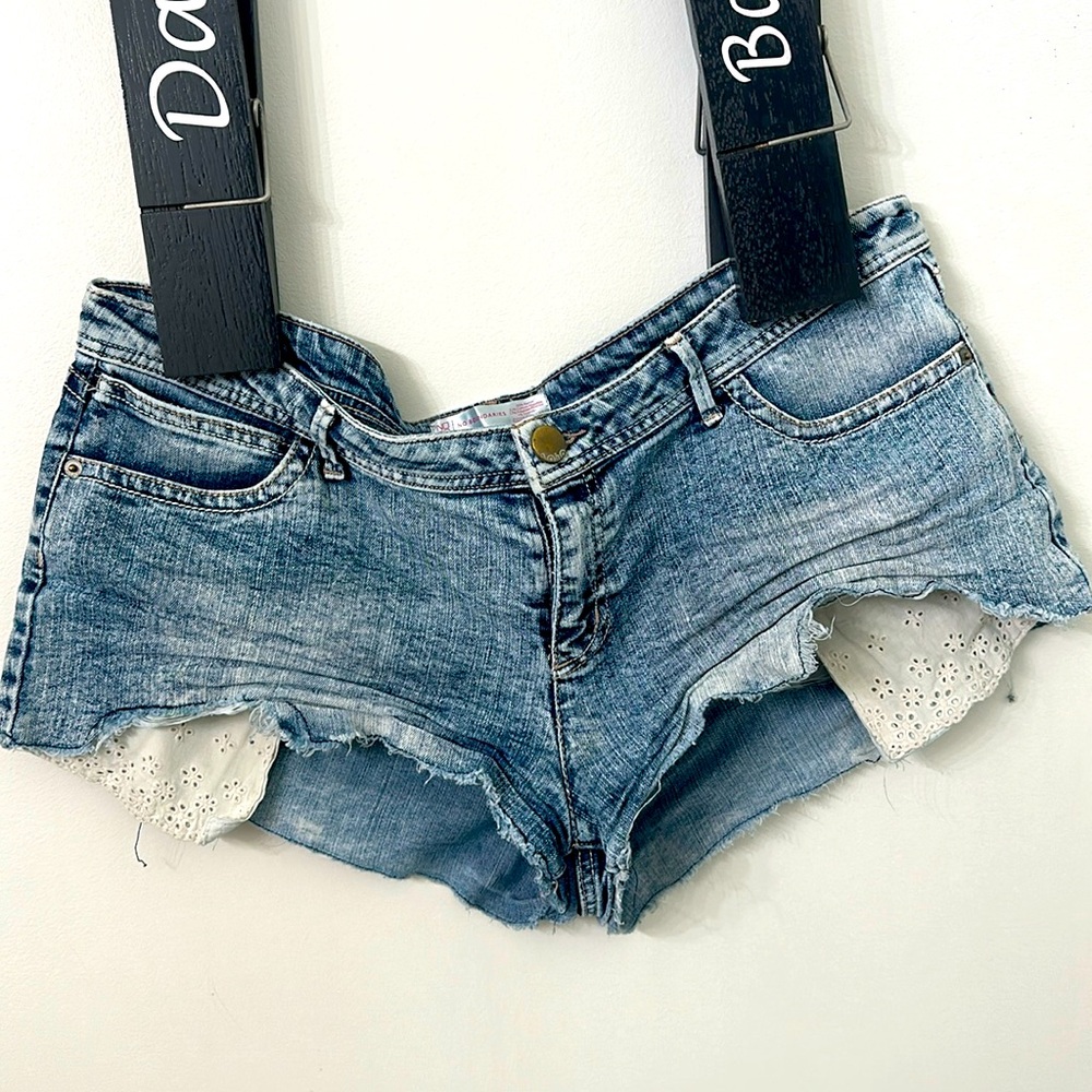 Distressed shorts with peek out pockets